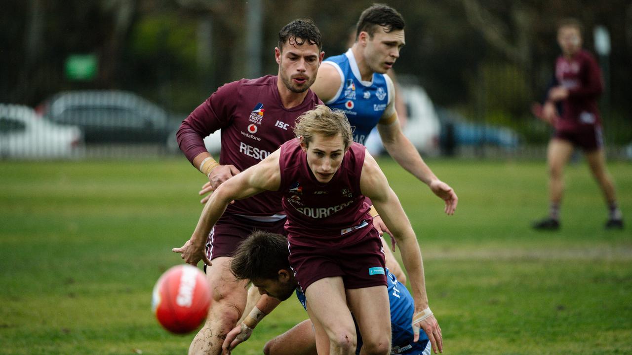 Oliver Clarke is seen tripping over a St Peter's player during the Prince Alfred versus St PeterÕs Old Collegians match on PACÕs front oval in Adelaide, Saturday, June 29, 2019. (AAP Image/ Morgan Sette)