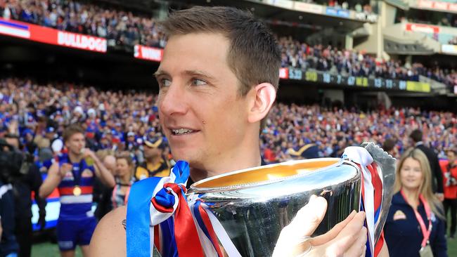 Dale Morris celebrates with the premiership cup.