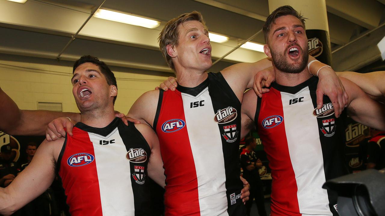 Leigh Montagna, Nick Riewoldt and Sam Fisher sing the song after the latter’s final game in 2016. Picture: Colleen Petch.