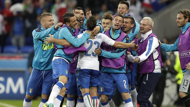 Italy's Emanuele Giaccherini, center, celebrates after scoring the opening goal.