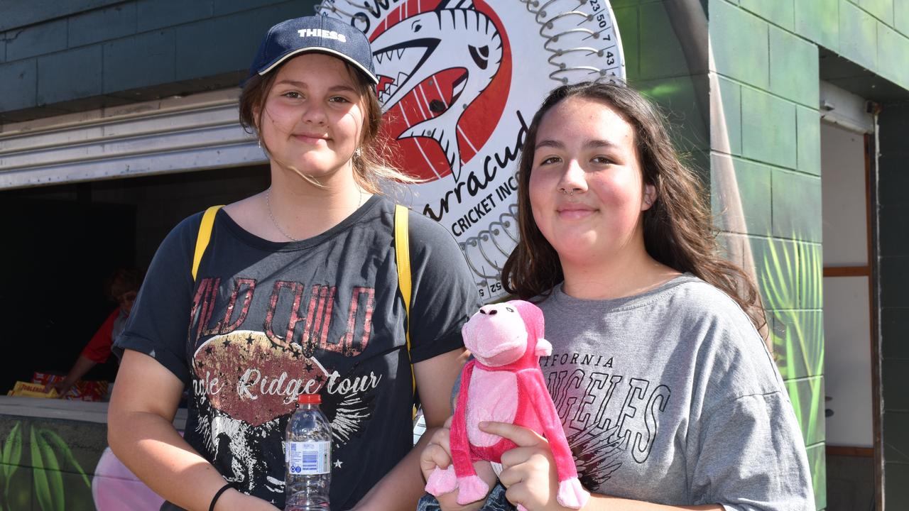 Shye Bannister and Mya Pini of Bowen had a spin of Bowen Cricket Club's Chocolate Wheel. Picture: Kirra Grimes