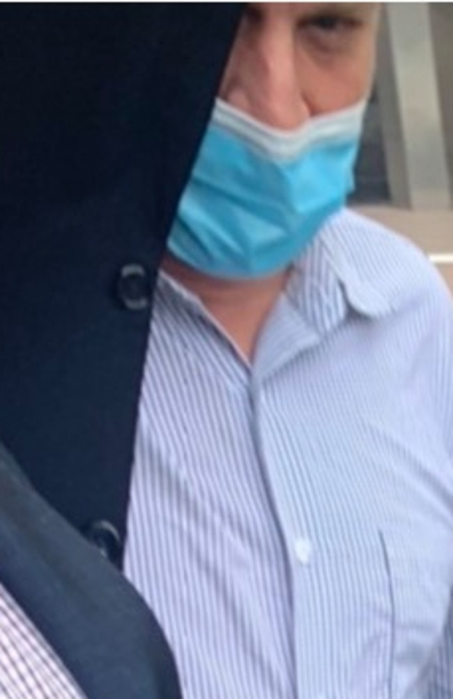 Nigel William Burlington put a jacket on his face as he left Maroochydore Magistrates Court.