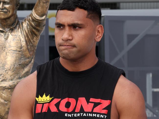 Tevita Pangai Junior outside Suncorp Stadium with the Wally Lewis statue. Picture: Liam Kidston