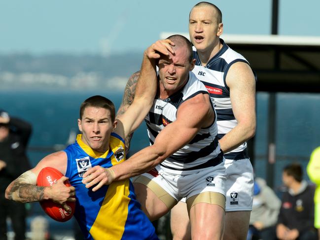 Geelong v Williamstown VFL match. Williamstown's Stephen Mccallum pushes off Geelong's Joshua Hunt.