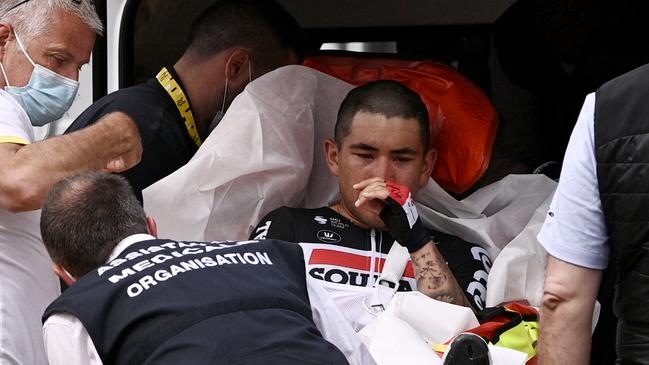 Caleb Ewan is evacuated in an ambulance after his crash (Photo by Anne-Christine POUJOULAT / POOL / AFP)