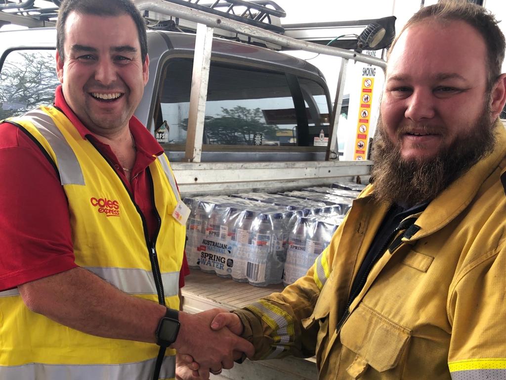 COMM EDITORIAL: Ben Elliot Coles site manager Taree R2A1 donating to Lansdowne Bush Fire Brigade. Picture: supplied