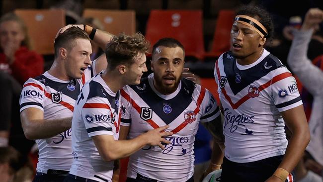 Matt Ikuvalu celebrates his try with teammates during the round eight NRL match between the Newcastle Knights and the Sydney Roosters. Picture: Ashley Feder/Getty Images