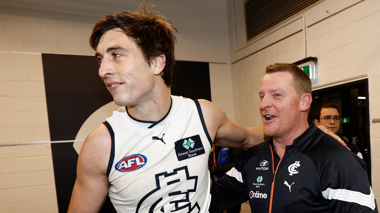 MELBOURNE, AUSTRALIA - AUGUST 6: Caleb Marchbank of the Blues and Michael Voss, Senior Coach of the Blues celebrate during the 2023 AFL Round 21 match between the St Kilda Saints and the Carlton Blues at Marvel Stadium on August 6, 2023 in Melbourne, Australia. (Photo by Michael Willson/AFL Photos via Getty Images)