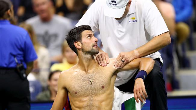 Novak Djokovic gets treatment during his match against Juan Ignacio Londero. Picture: Getty Images