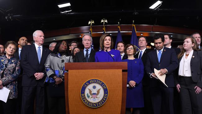 Speaker of the House Nancy Pelosi and House Ways and Means Committee Chairman Richard Neal with other Democrats. Picture: AFP