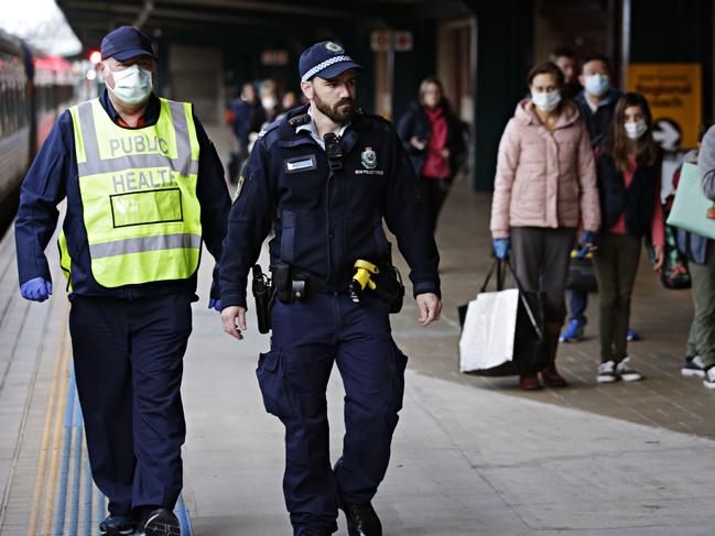 NSW Police at Central Station this morning where authorities were checking travellers arriving from Melbourne. Picture: Adam Yip