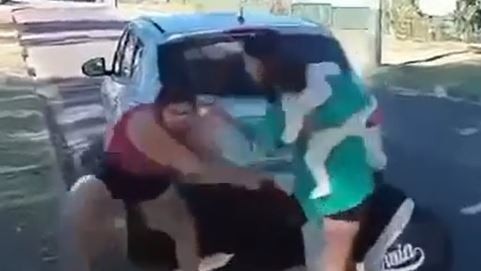 A woman with a baby in her arms involved in a confrontation in Mount Isa.