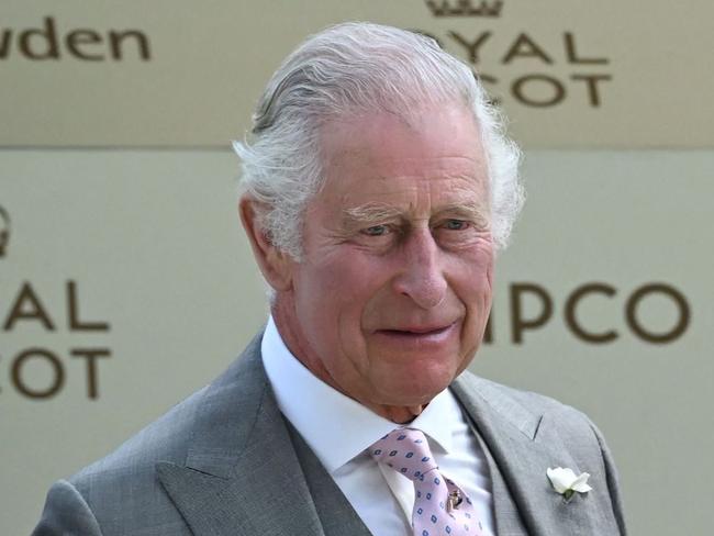 Britain's King Charles III stands with his trophy, at the presentation after his horse, Desert Hero wins the King George V Handicap on the third day of the Royal Ascot horse racing meeting in Ascot, west of London, on June 22, 2023. (Photo by JUSTIN TALLIS / AFP)