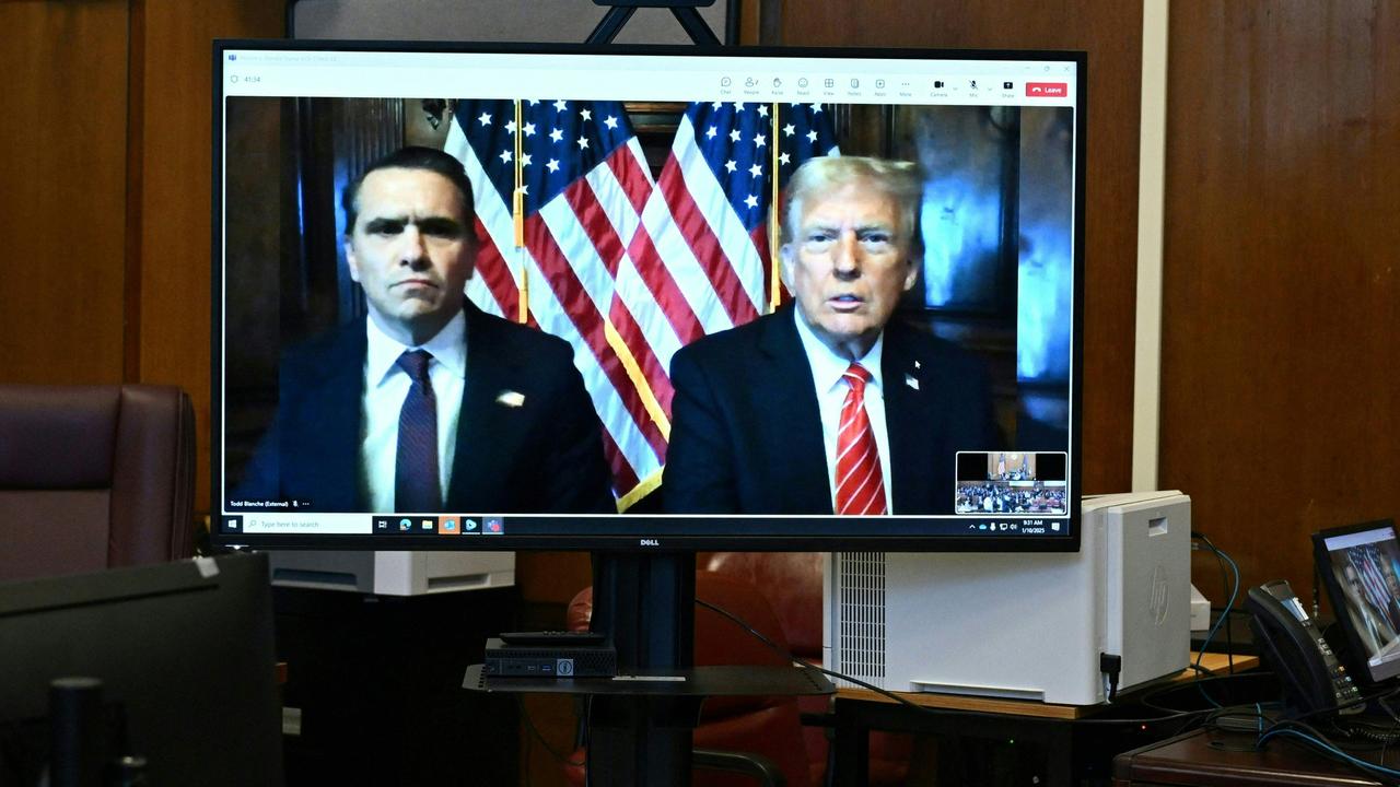 Todd Blanche, lawyer for former US President Donald Trump, and US President-elect Donald Trump are seen on the screen at Manhattan criminal court in New York, on January 10, 2025. (Photo by ANGELA WEISS / POOL / AFP)