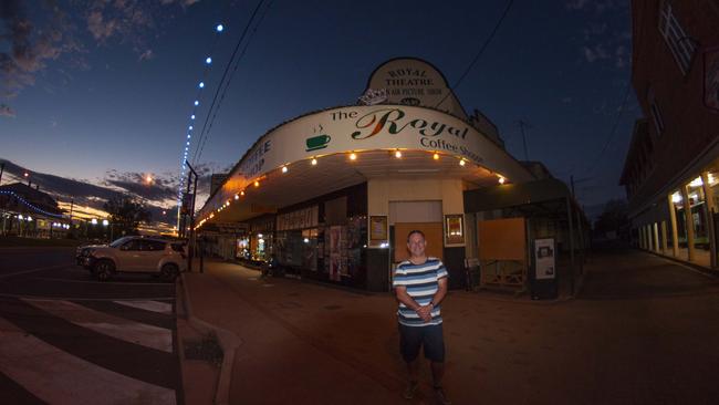 Elliot in front of the Royal Theatre and Royal Coffee Shop. Picture: Steve Lippis