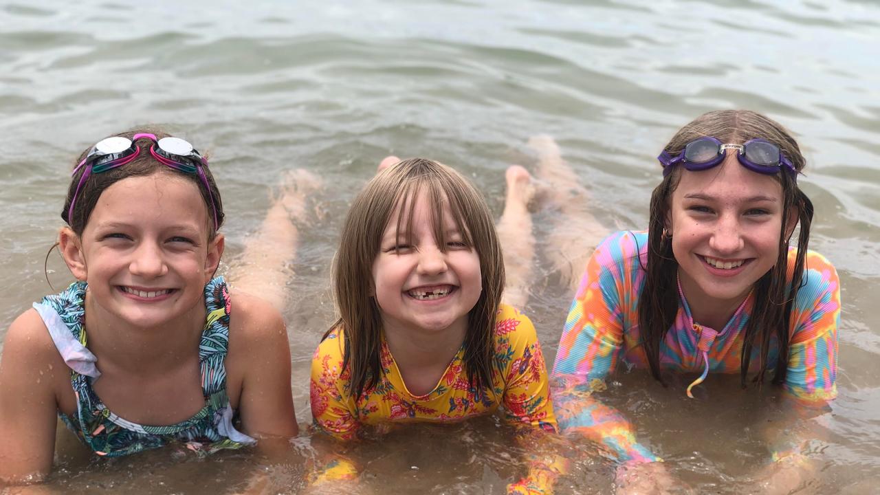 Imogen Murphy, Maye and Alys Beutel enjoy Christmas celebrations at Cotton Tree Park. Picture: Laura Pettigrew.