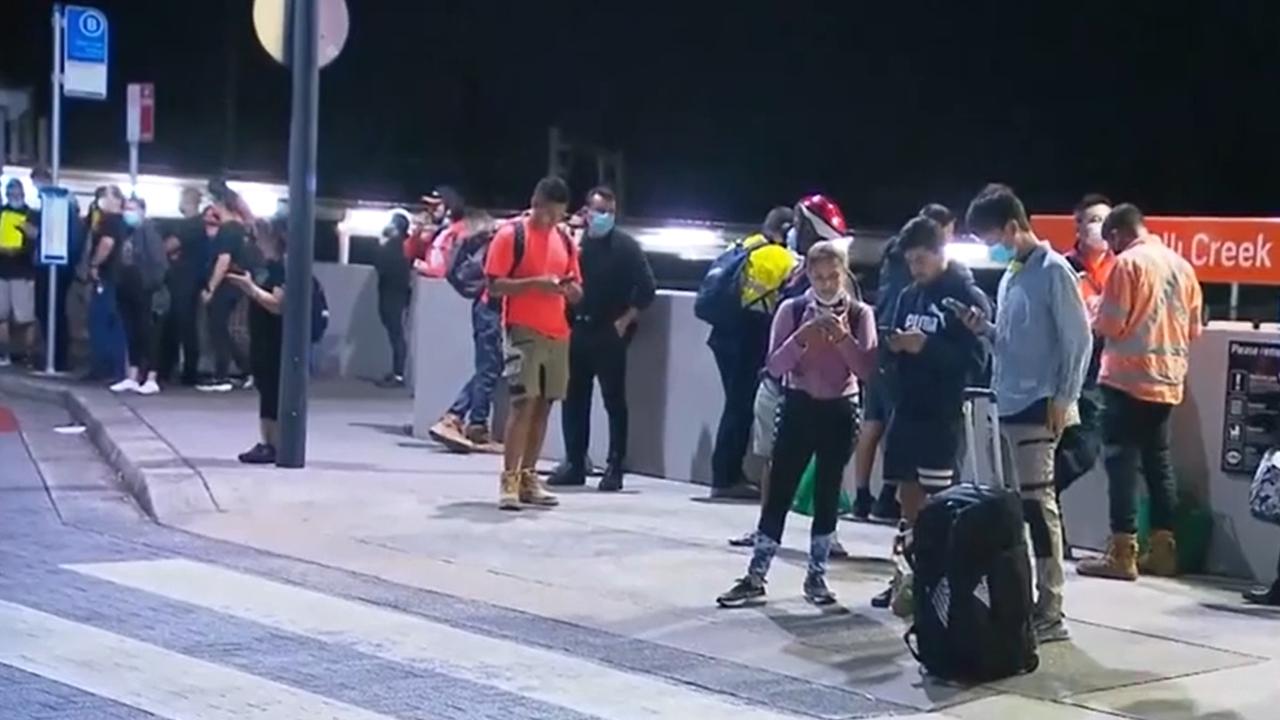 Confused commuters at Wolli Creek after all trains were cancelled across Sydney on Monday morning. Picture: 7News