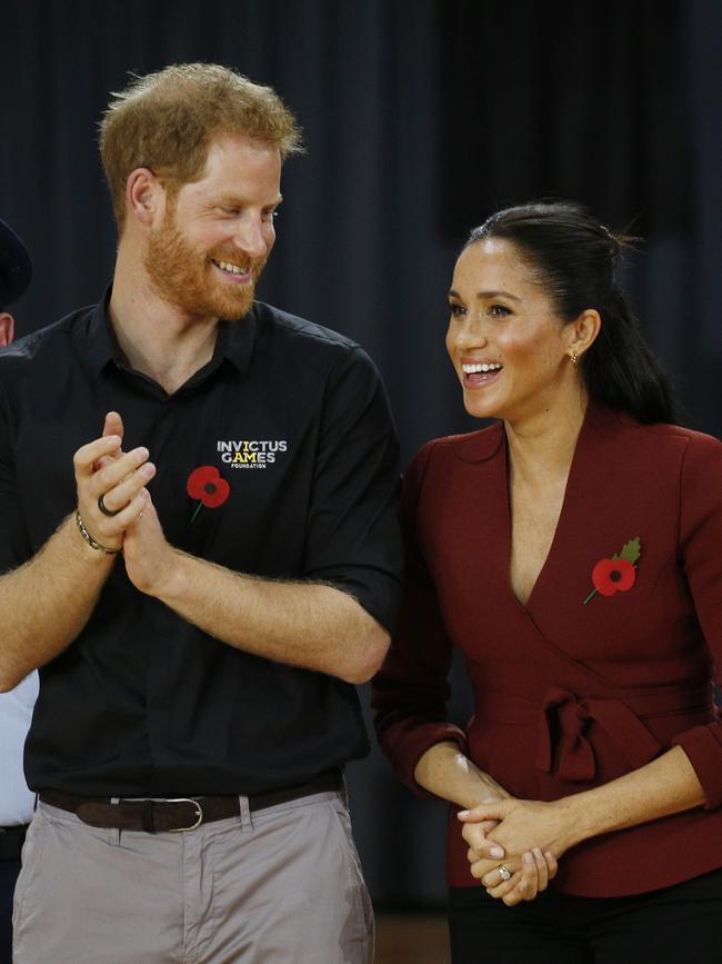 Prince Harry and Meghan at the Invictus Games Wheelchair Basketball game at Sydney Olympic Park. Picture: Richard Dobson