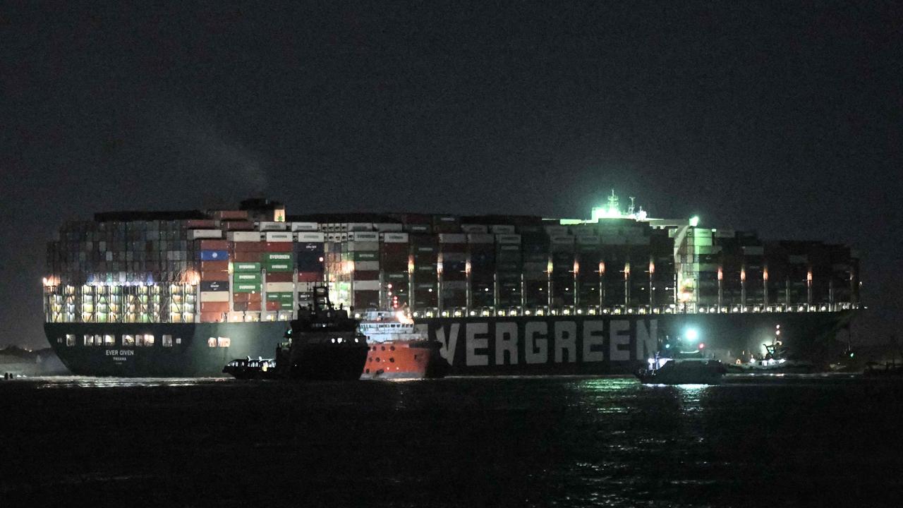 Tugboats around the MV Ever Given on Saturday. Picture: Ahmed Hasan/AFP