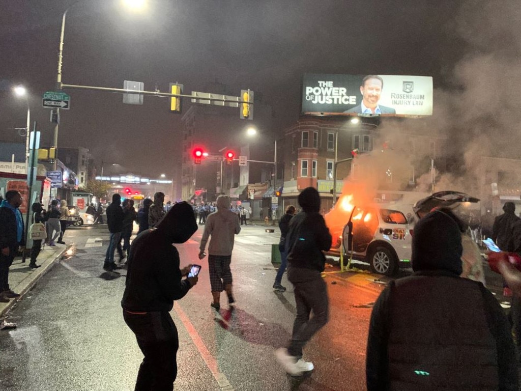 A police car set alight in West Philadelphia. Picture: @samanthamelamed