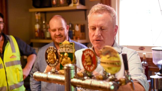 Premier Jeremy Rockliff at the James Boag's Visitor Centre at 39 William St, Launceston, pulling a beer as brewery director Nathan Calman looks on. Picture: Alex Treacy