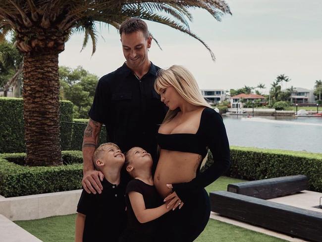 Ironman Matt Poole and Tammy Hembrow are expecting a baby girl later this year. Photo: Carlene Raschke