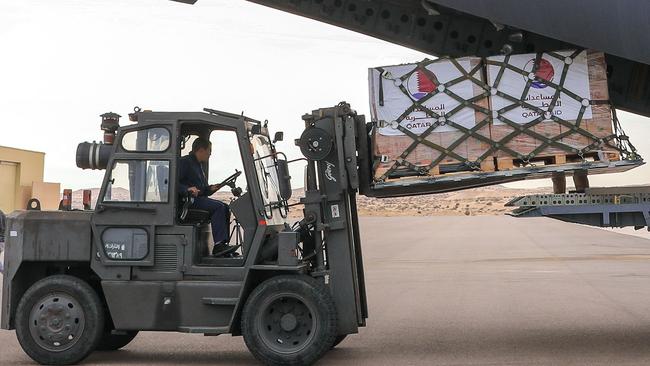 The aid is unloaded at Egypt’s El Arish airport on Wednesday. Picture: AFP