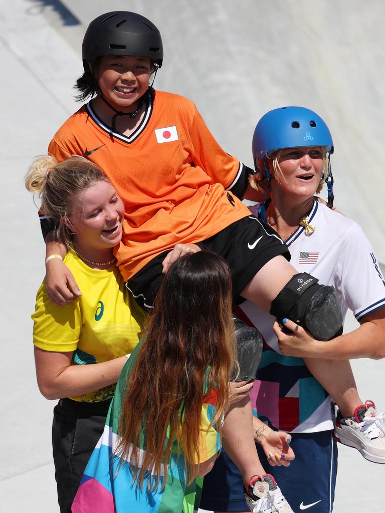 Misugu Okamoto is carried out of the bowl by Aussie Poppy Olsen and American Bryce Wettstein. Picture: Jamie Squire/Getty Images