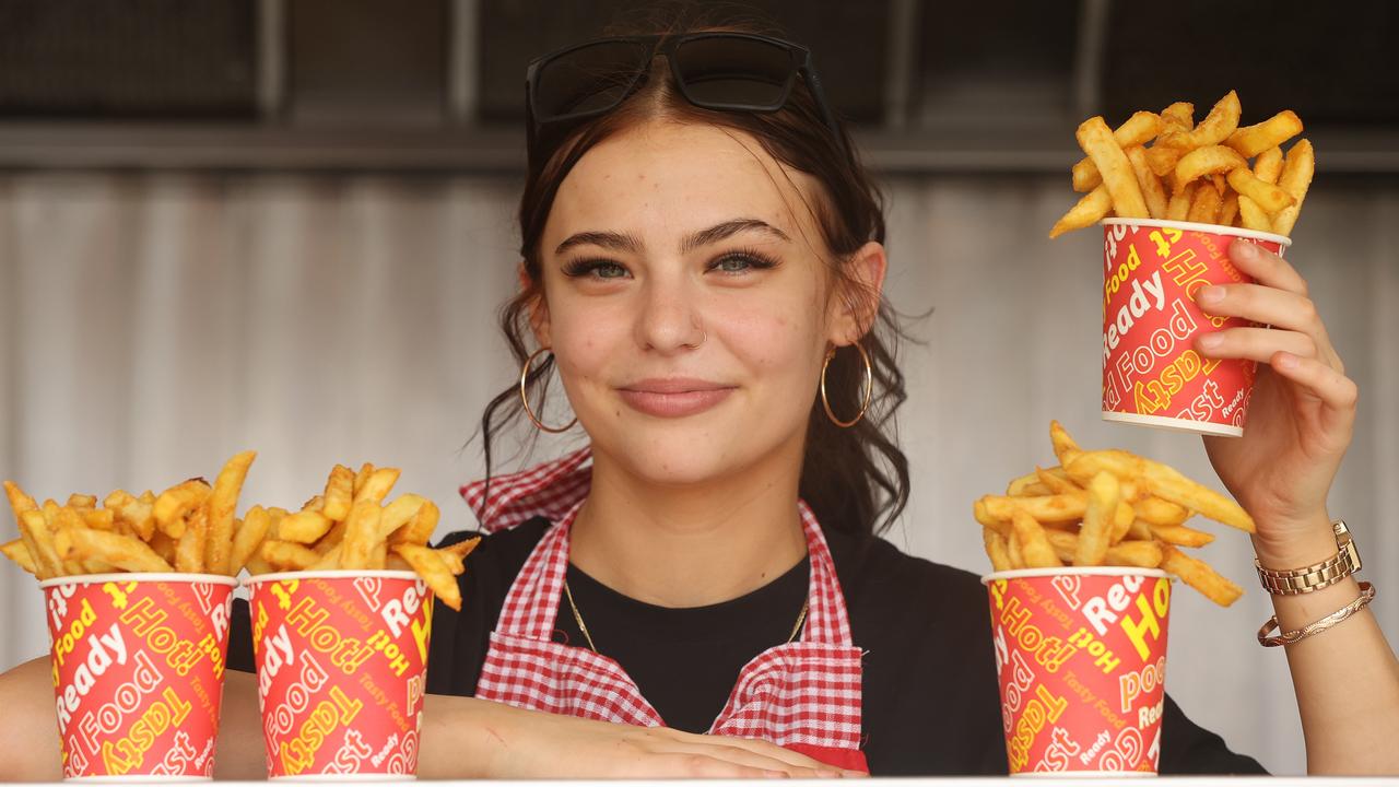 Ebony Sawbridgworth with $8 bucket of chips at food van at the Geelong Show. Picture: Alison Wynd