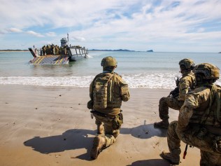 Imagery supplied by defence for coverage of the DSR -  Australian Army soliders from 10th Force Support Battalion's Amphibious Beaching Team await the arrival of troops on an Lighter Landing Craft during Exercise Trident 2022 near Shoalwater Bay Training Area, Queensland.