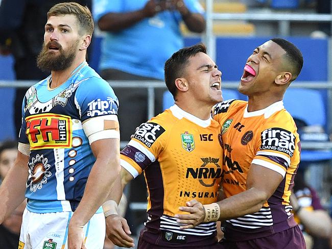 Kodi Nikorima of the Broncos (centre) celebrates after scoring a try during the Round 17 NRL match between the Gold Coast Titans and the Brisbane Broncos at Cbus Super Stadium in Robina on the Gold Coast. Sunday, July 8, 2018. (AAP Image/Dave Hunt) NO ARCHIVING, EDITORIAL USE ONLY