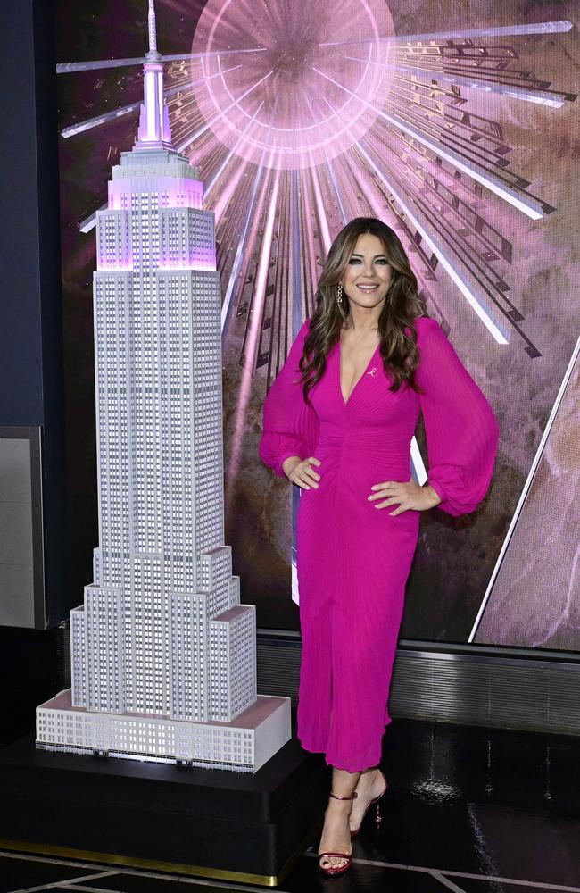 Elizabeth Hurley wears all pink as she lights the Empire State Building in honour of Estee Lauder’s breast cancer awareness campaign. Picture: Eugene Gologursky/Getty Images for Empire State Realty Trust