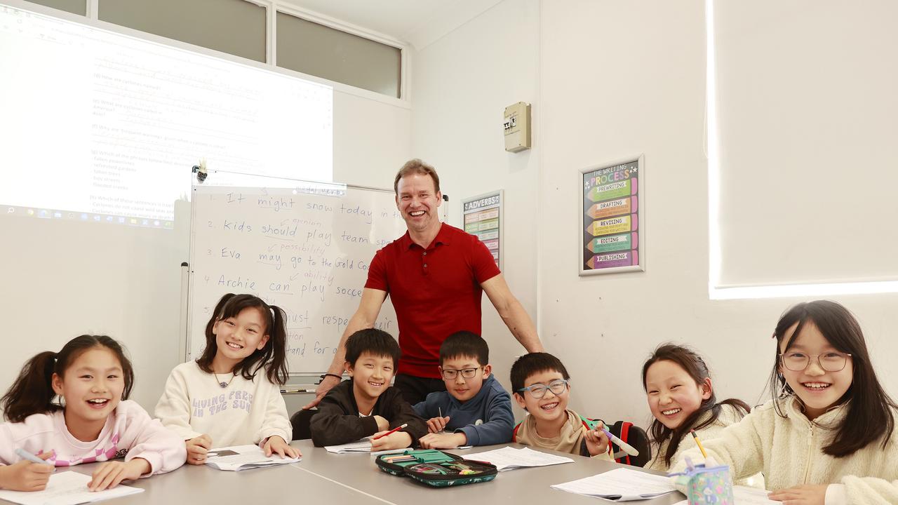 Pictured with students (L-R) Tian Hu, Mia Hu, Anthony Chang, Kenneth Liu, Jerrel Yan, Eva Teng and Chloe Ma, is Tim Ricketts who is a tutor and runs his business, Mr Tims Tutoring in Beecroft. Picture: Tim Hunter.