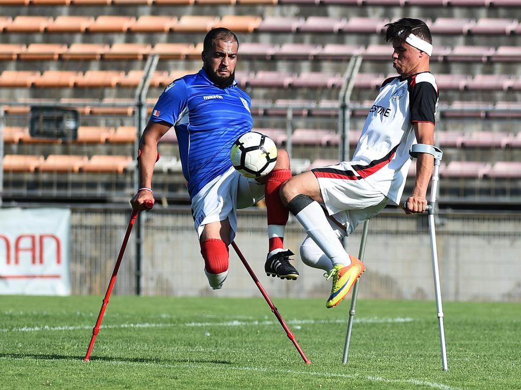 Palestinian Omar Abo Hasshem, right, fights for the ball with French Sofiane Ben Hamed during a friendly football match of players with amputated limbs between Palestine and France. Picture: AFP
