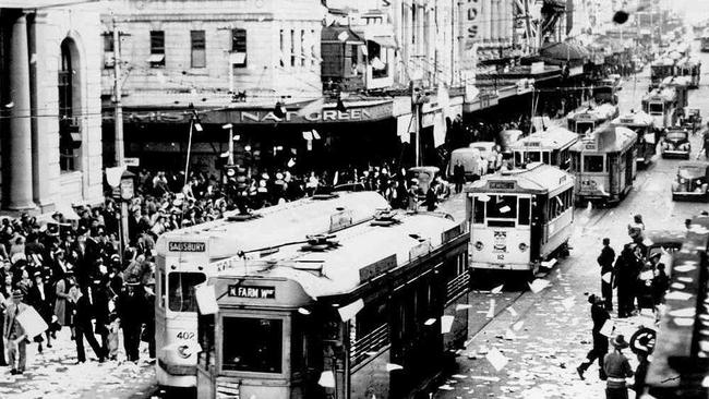 People celebrating the end of World War II in Queen Street, Brisbane in 1945. Photograph taken at the intersection of Queen and Edward Streets, looking south along Queen Street.Photo: State Library of Queensland. Picture: Contributed