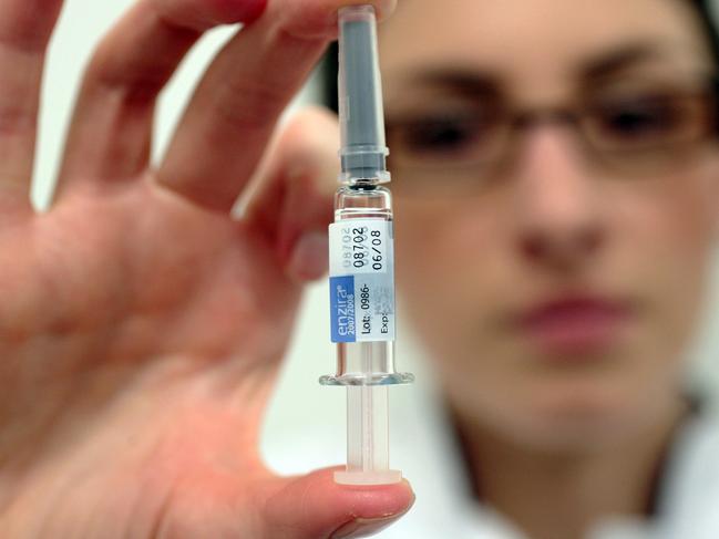 Nicky Healey, a nurse at a Boots pharmacy, displays a vial of CSL Ltd.'s Enzira seasonal flu vaccine in Holborn, London, U.K., on Thursday, Nov. 8, 2007. Seasonal flu strikes 5 percent to 15 percent of the population and kills 250,000 to 500,000 people a year worldwide, according to the World Health Organization. Photographer: Graham Barclay/Bloomberg News [HOLD FOR STORY -- EMBARGOED UNTIL CDC PRESS CONFERENCE ON FRI, NOV. 9 AT 5 PM ET]