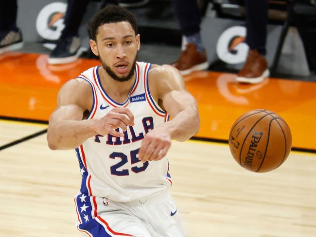 (FILES) In this file photo taken on February 13, 2021, Ben Simmons of the Philadelphia 76ers passes the ball during the first half of the NBA game against the Phoenix Suns at Phoenix Suns Arena in Phoenix, Arizona. NOTE TO USER: User expressly acknowledges and agrees that, by downloading and or using this photograph, User is consenting to the terms and conditions of the Getty Images License Agreement.   Christian Petersen/Getty Images/AFP - Simmons was hit with a one-game suspension by the team on October 19, 2021, ruling him out of the club's season opener against New Orleans. A Sixers statement said Simmons would miss the October 20 game against the Pelicans for "conduct detrimental to the team." US media reports said Simmons was suspended shortly after a bust-up with Sixers coach Doc Rivers, which ended with the Australian point guard being tossed from practice. (Photo by Christian Petersen / GETTY IMAGES NORTH AMERICA / AFP)