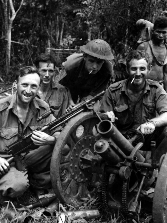 Aussie gunners pose with a captured Japanese gun on the Kokoda Trail.