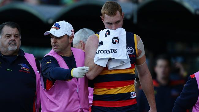 Tom Lynch is taken off Adelaide Oval after the collision. Picture: SARAH REED.