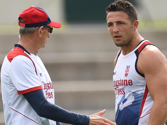 Sam Burgess and coach Wayne Bennett talk during a training session.