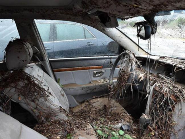 A left-hand drive car ruined in a US hurricane event was presented as a car wrecked in floods in NSW. Picture: Supplied