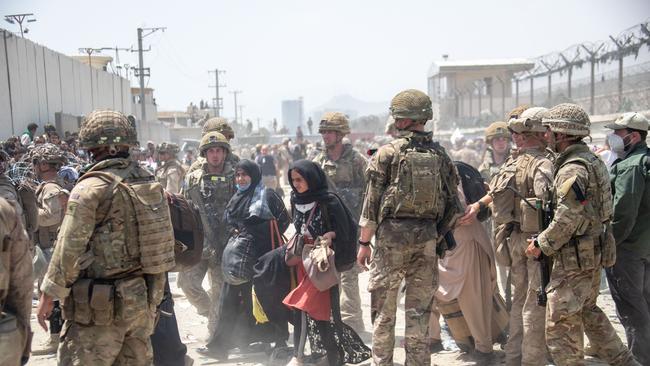 British troops work with the US military at Kabul airport to evacuate people out of Afghanistan on Saturday. Picture: UK Ministry of Defence via Getty Images