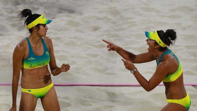 Australian beach volleyball duo Taliqua Clancy (left) and Mariafe Del Solar Artacho on their way to victory against Vanuatu tonight. Photo: AFP