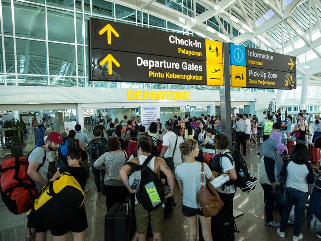 DENPASAR, BALI, INDONESIA - JULY 13:  Foreign tourists arrive at Ngurah Rai International airport departure on July 13, 2015 in Denpasar, Bali, Indonesia. Bali's international airport reopened after being closed due to volcanic ash clouds from Maunt Raung, but Australia's main carriers to the holiday destinations are still not flying. (Photo by Agung Parameswara/Getty Images)