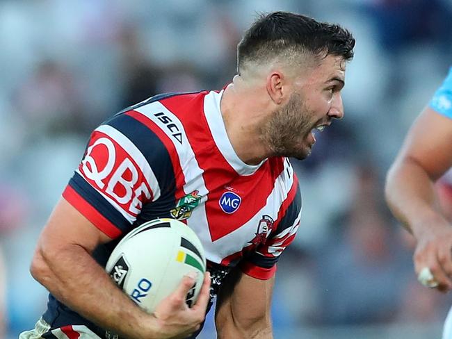 GOSFORD, AUSTRALIA - MAY 26:  James Tedesco of the Roosters makes a break during the round 12 NRL match between the Sydney Roosters and the Gold Coast Titans at Central Coast Stadium on May 26, 2018 in Gosford, Australia.  (Photo by Tony Feder/Getty Images)