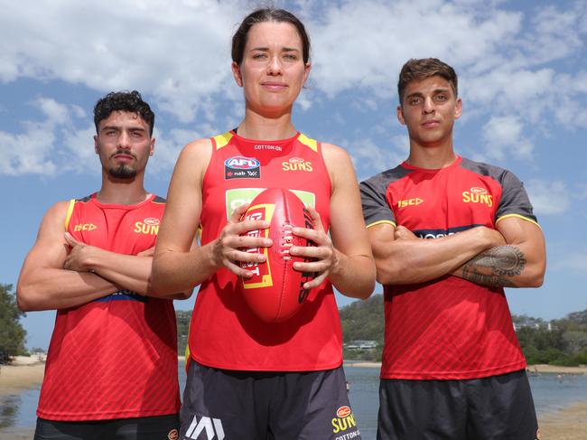 Gold Coast SUNS players at Currumbin. Izak Rankine, Lauren Ahrens, and Sean Lemmens on the beach at Currumbin. . Picture Glenn Hampson