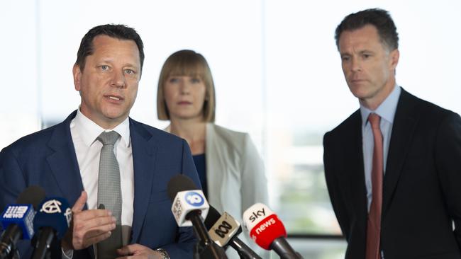 NSW Planning Minister Paul Scully, left, flanked by Premier Chris Minns, right, as the government announced planning and housing reform in December. Picture: Monique Harmer