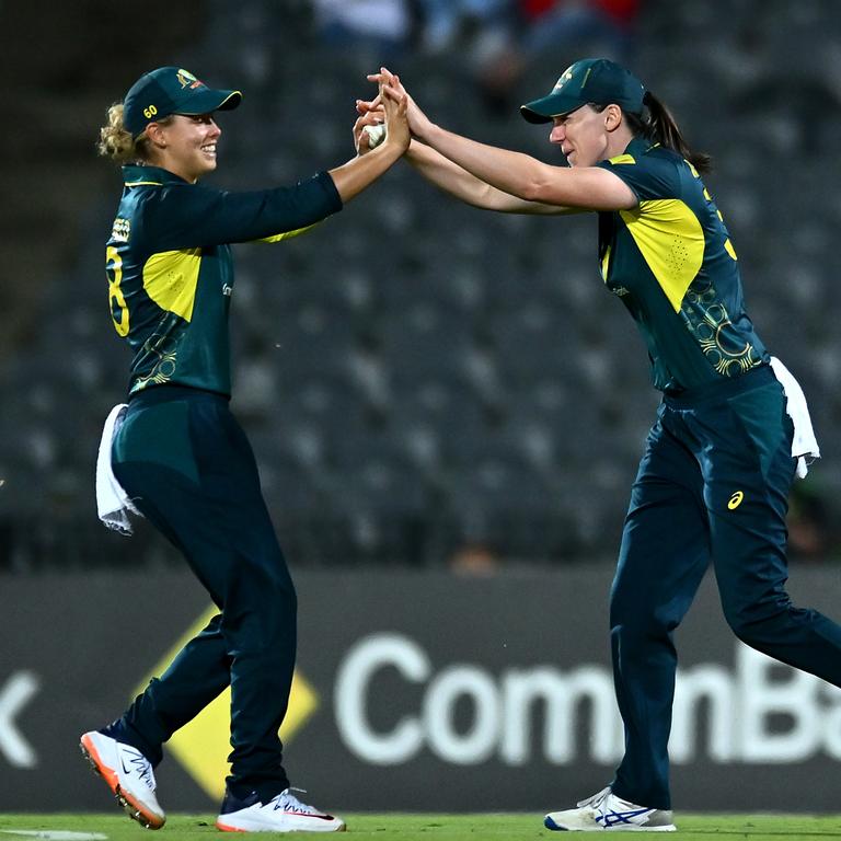 Phoebe Litchfield of Australia is congratulated by Tahlia McGrath after taking a screamer to remove Suzie Bates during game two of the Women's T20 International Series between Australia and New Zealand. (Photo by Albert Perez/Getty Images)