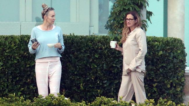 Julia Roberts (left) woke early on Sunday morning to take in the view from her Sydney Harbour holiday home with her staffers. Picture: Matrix Media