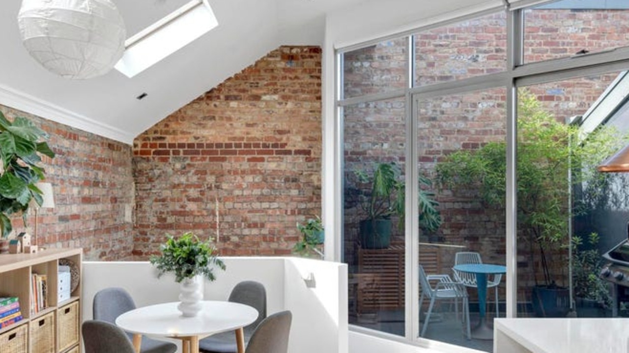 Exposed brick gives the townhouse an industrial feel.